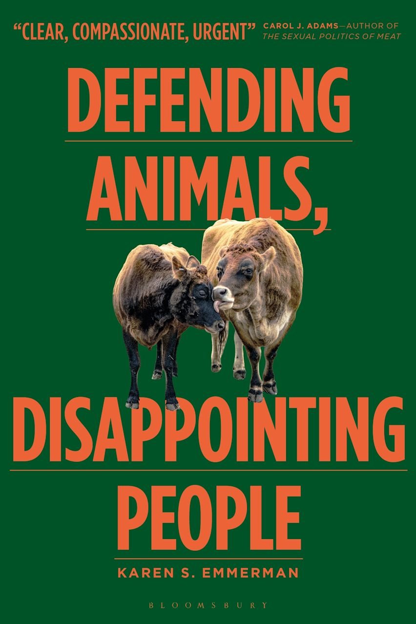 Book cover: two cows nuzzle beneath orange lettering on a deep green background.